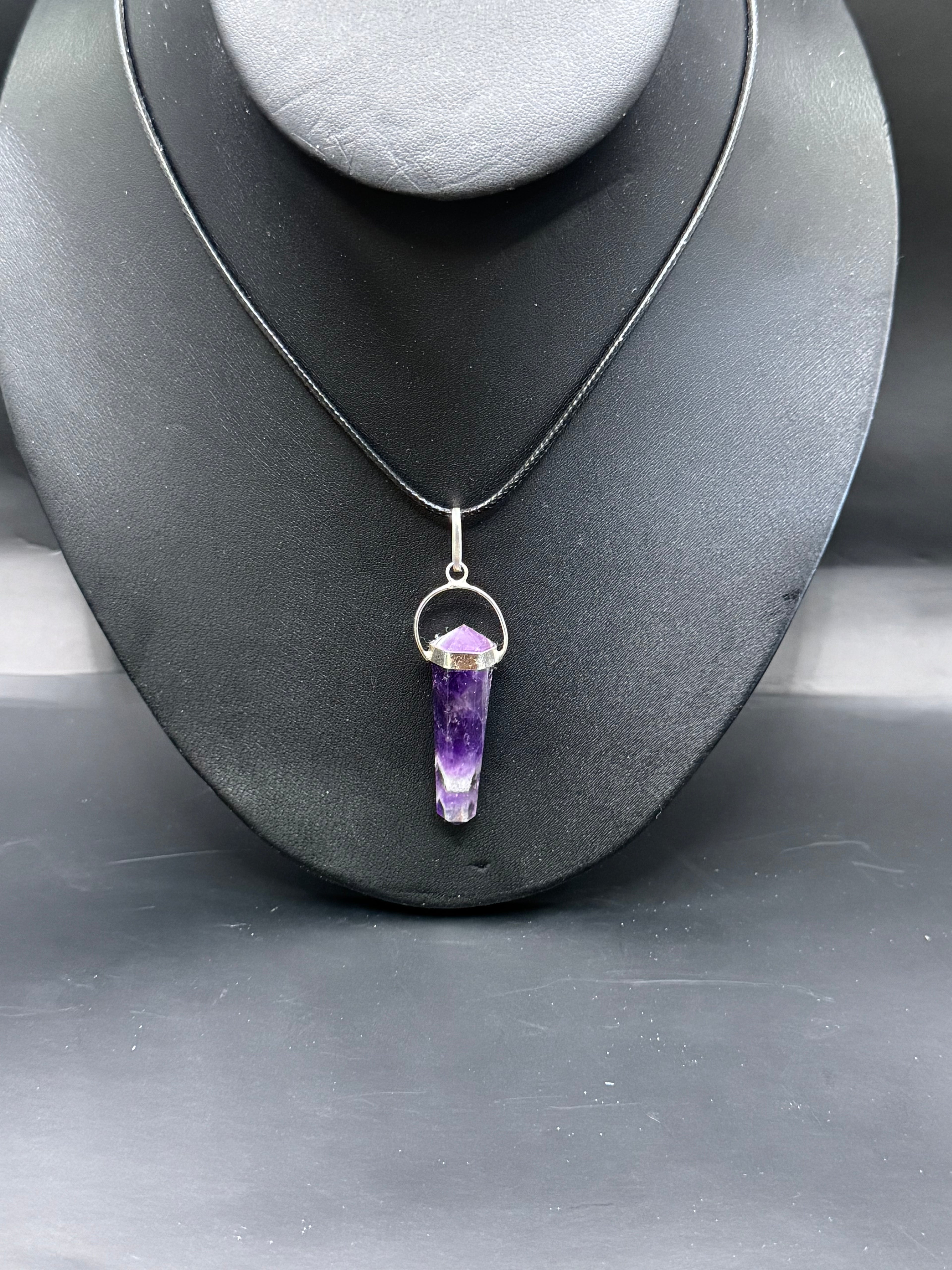 Amythyst pendulum necklace.