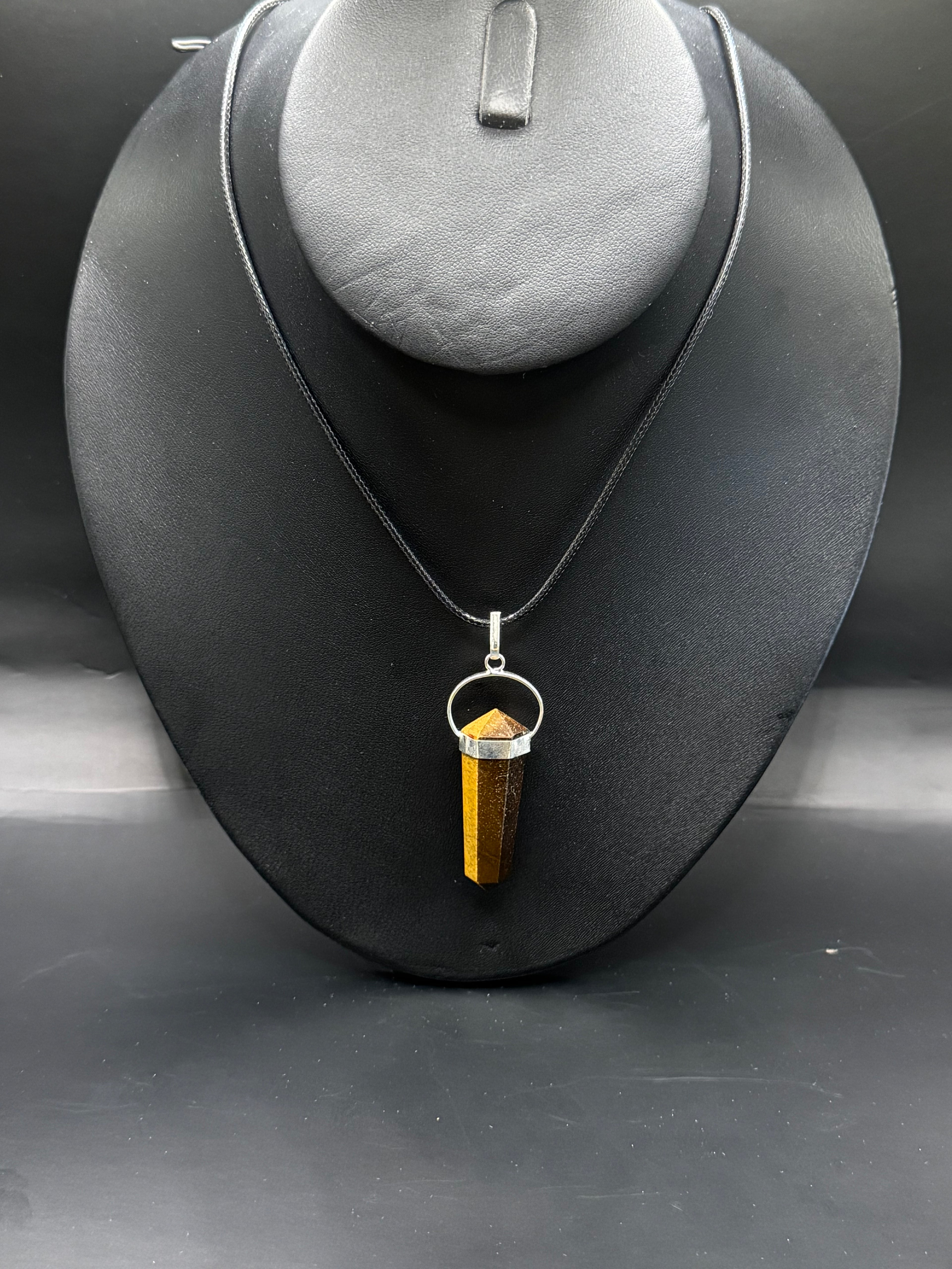 Tigers eye pendulum necklace.